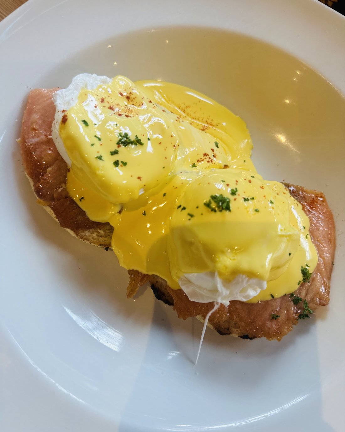 Eggs Benedict with smoked salmon at Cates Café: poached eggs and hollandaise over salmon on a toasted muffin.